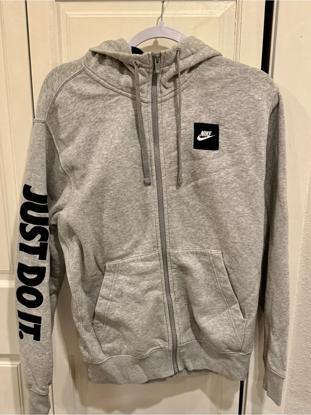 Nike Gray Full-Zip Hoodie with Black Logo and Sleeve Text